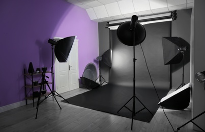 Photo of Interior of modern photo studio with professional equipment