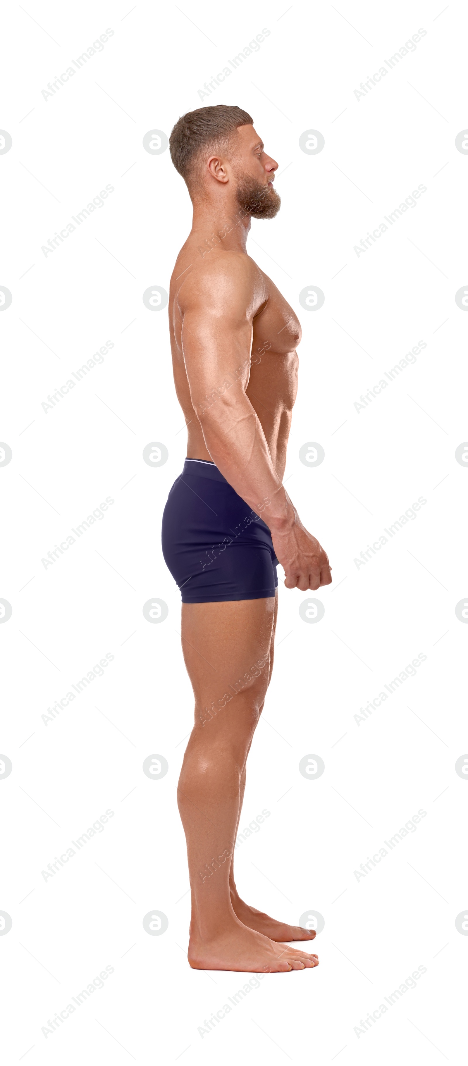 Photo of Young bodybuilder with muscular body on white background