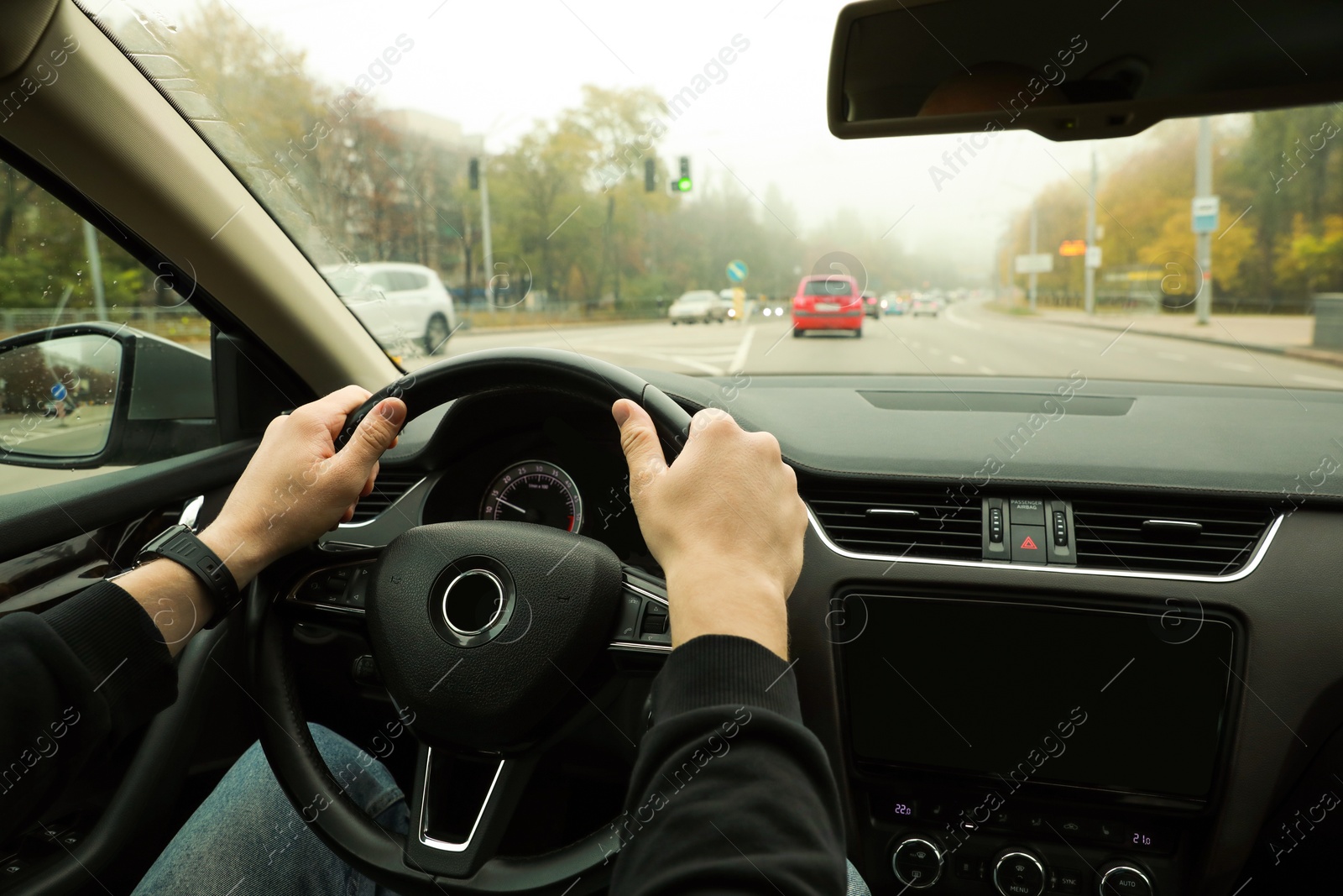 Photo of Man driving his car, closeup. Traffic rules