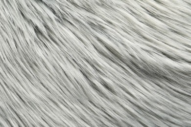 Photo of Texture of grey faux fur as background, closeup