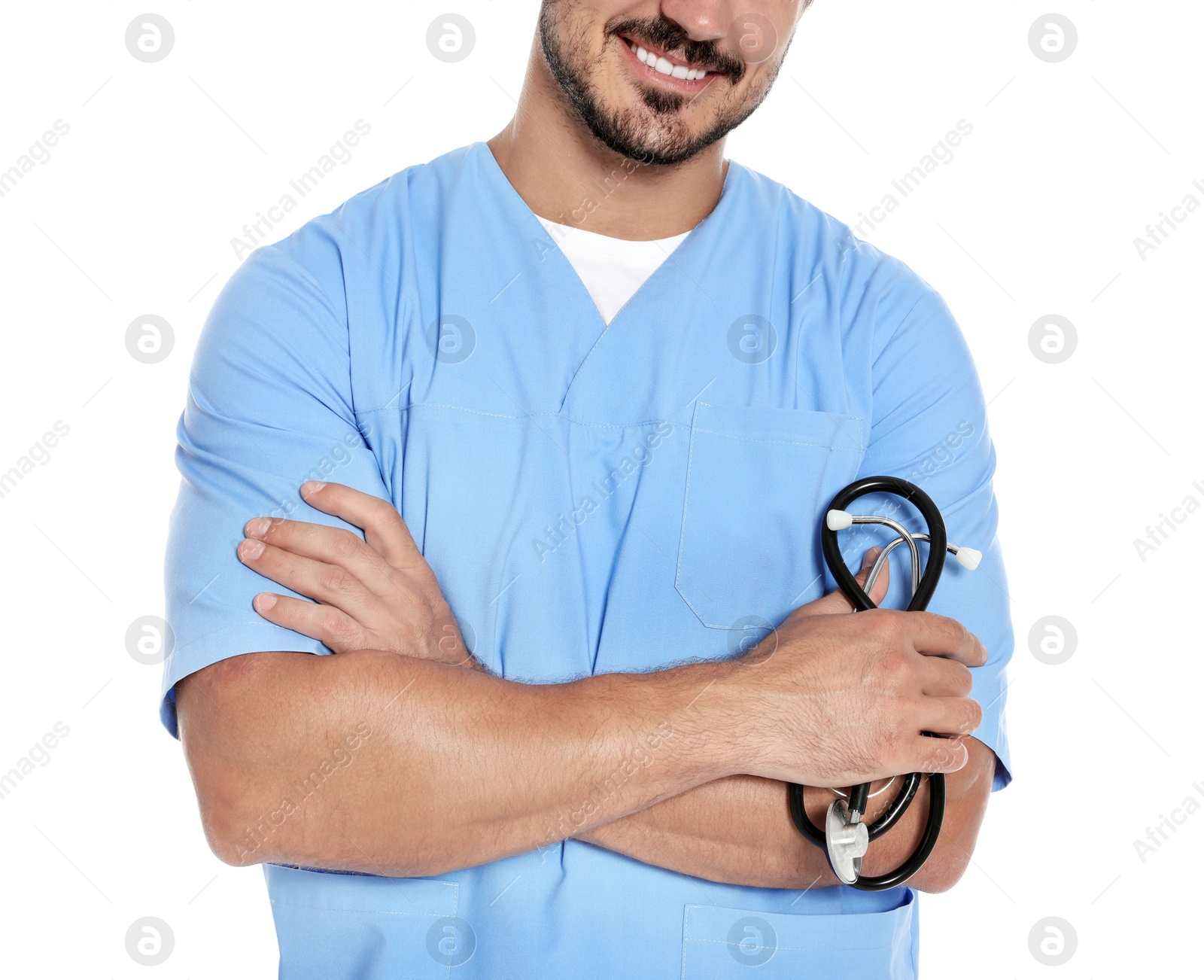 Photo of Young male doctor in uniform with stethoscope on white background, closeup. Medical service
