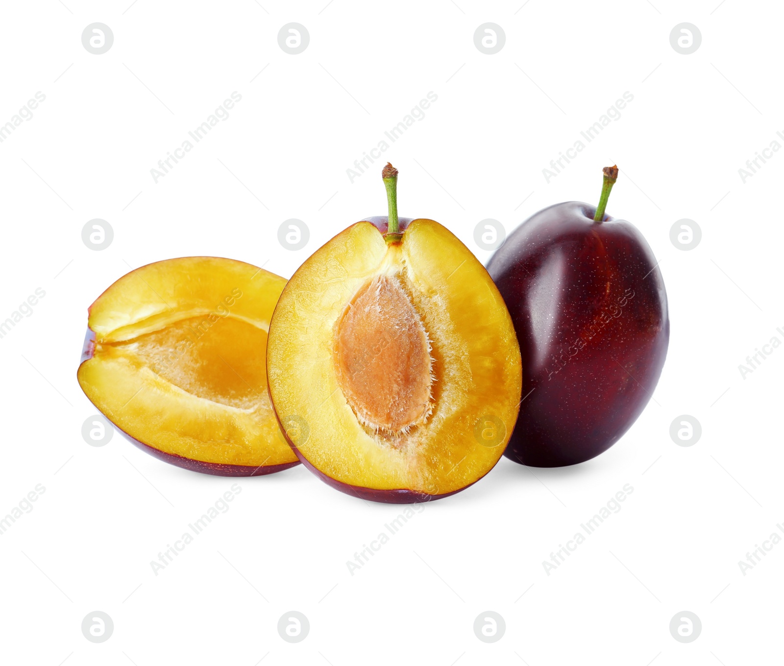 Photo of Whole and cut ripe plums on white background