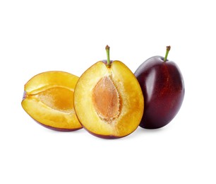 Photo of Whole and cut ripe plums on white background