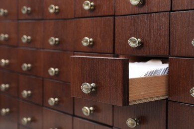 Photo of Open wooden drawer with index cards of library catalog