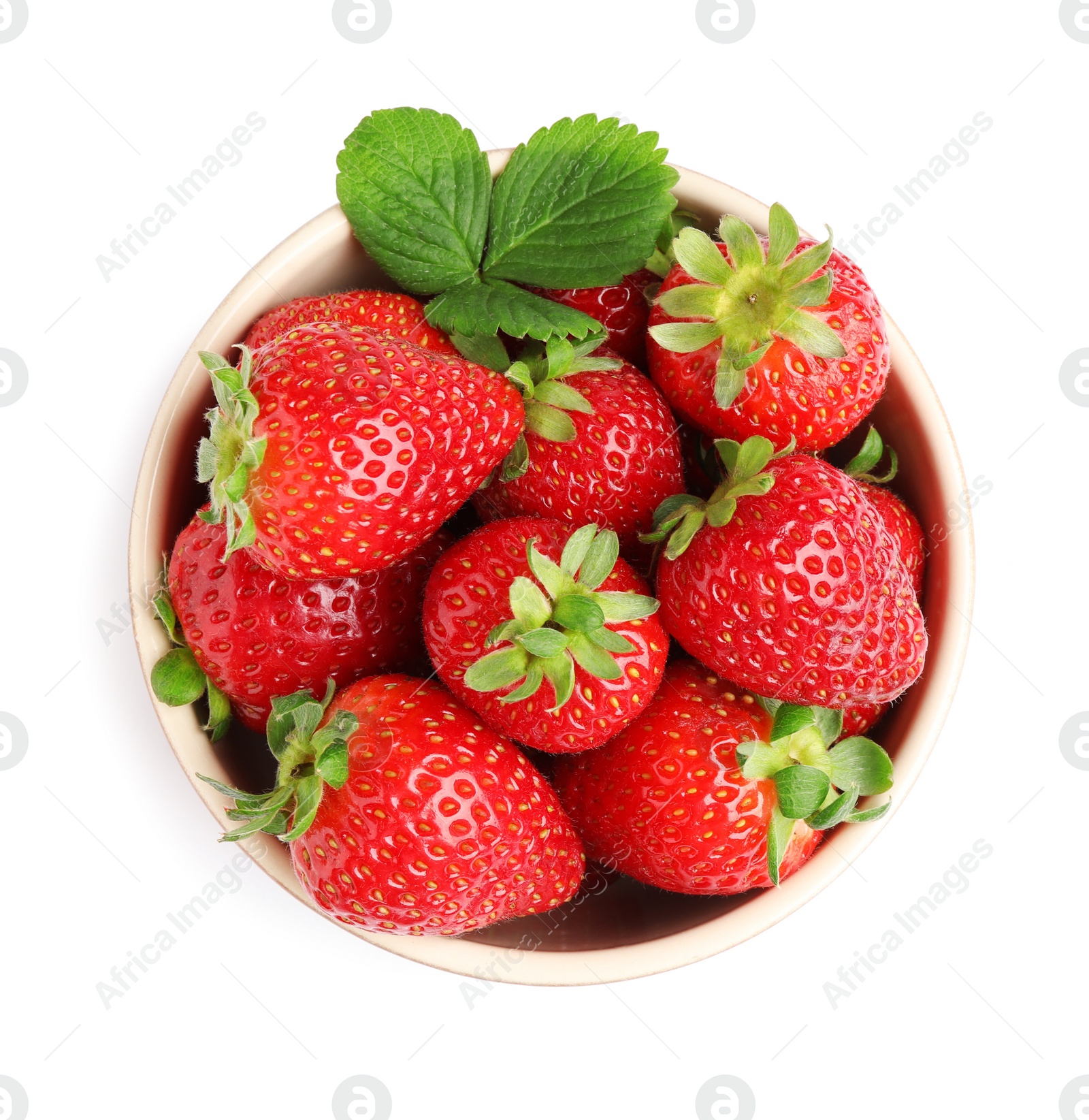 Photo of Fresh strawberries and green leaf in bowl isolated on white, top view