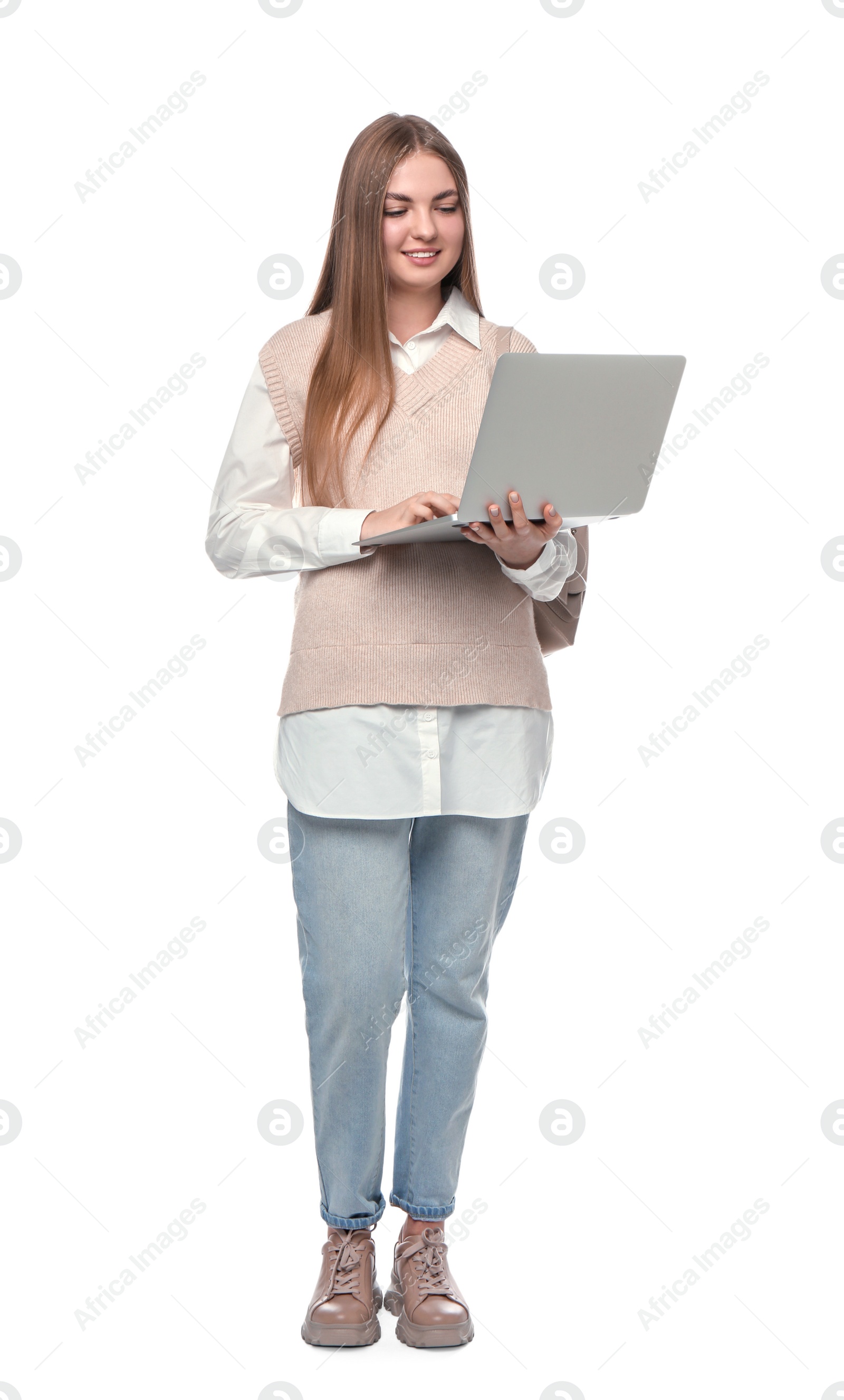 Photo of Teenage student with backpack using laptop on white background