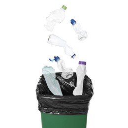 Image of Garbage falling into trash bin on white background