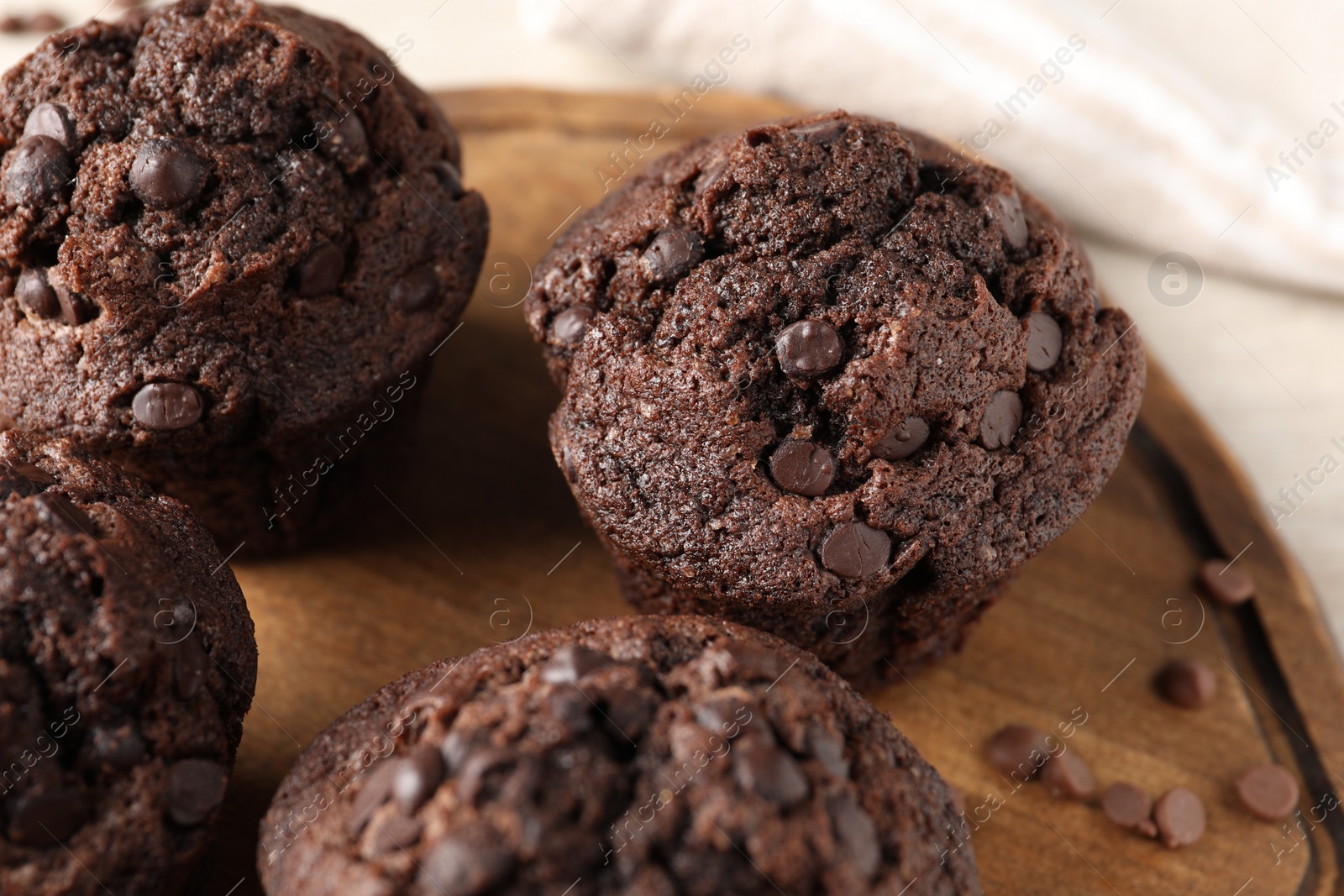 Photo of Delicious fresh chocolate muffins on table, closeup