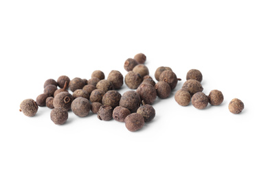 Photo of Spicy black pepper grains isolated on white