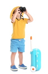 Cute little boy with hat, binocular and blue suitcase on white background