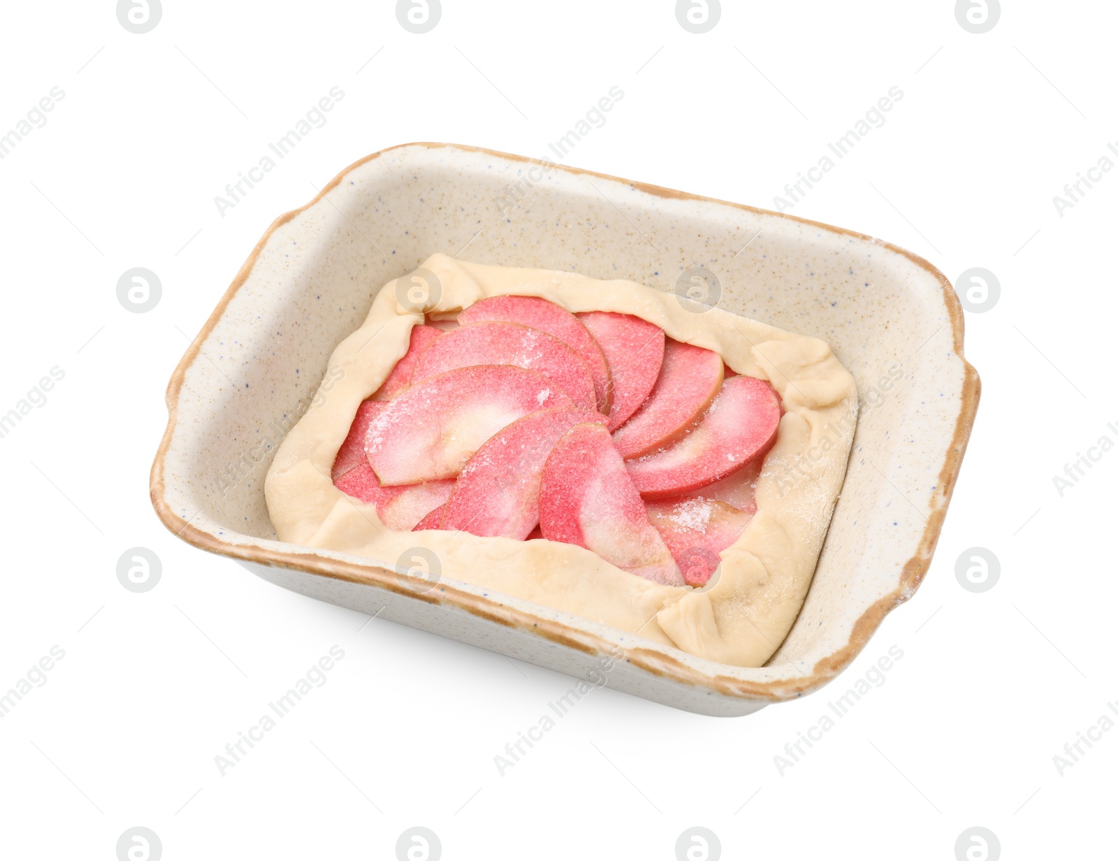 Photo of Baking dish with fresh dough and apples isolated on white. Making galette