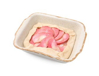 Baking dish with fresh dough and apples isolated on white. Making galette