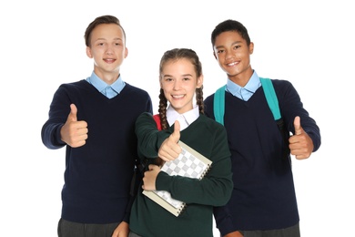 Teenagers in stylish school uniform on white background