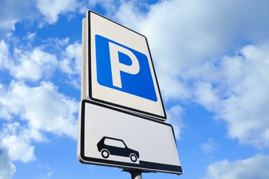 Traffic sign PARKING outdoors, low angle view