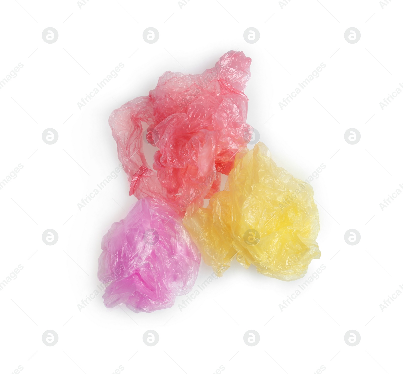 Photo of Crumpled plastic bags isolated on white, top view