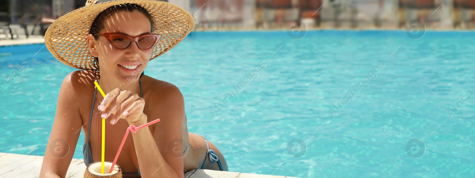 Image of Beautiful woman with tropical cocktail in swimming pool on sunny day, banner design