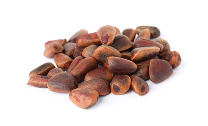 Photo of Heap of pine nuts on white background. Healthy snack