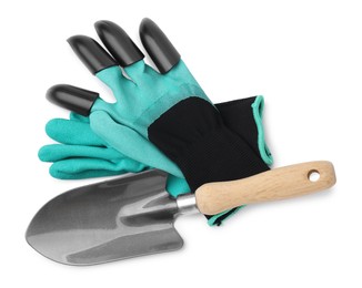 Photo of Claw gardening gloves and trowel isolated on white, top view