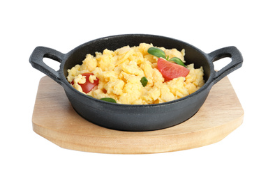 Tasty scrambled eggs with sprouts and cherry tomato in frying pan isolated on white