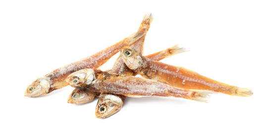 Photo of Delicious dried salted anchovies on white background