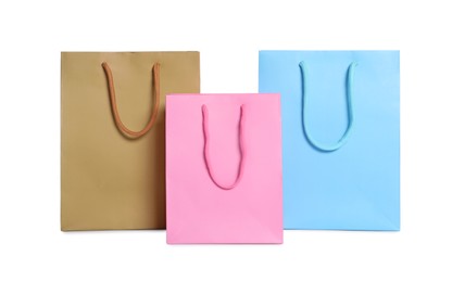 Photo of Colorful paper shopping bags isolated on white