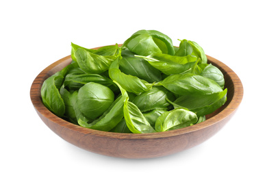 Fresh basil leaves in wooden bowl isolated on white