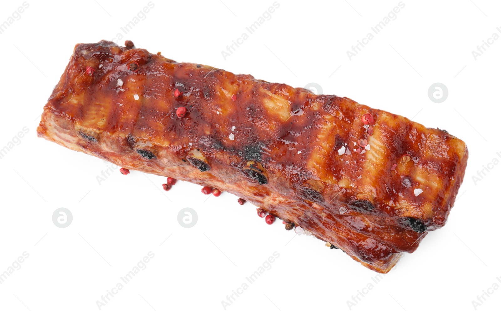 Photo of Tasty roasted pork ribs and peppercorns isolated on white, top view