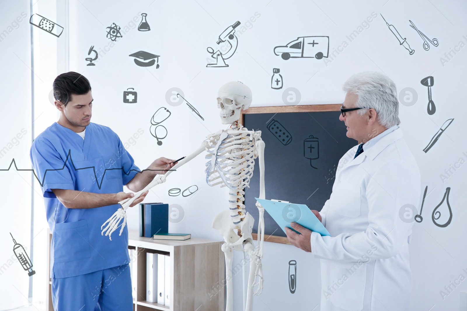 Image of Medical student and professor studying human skeleton anatomy in classroom