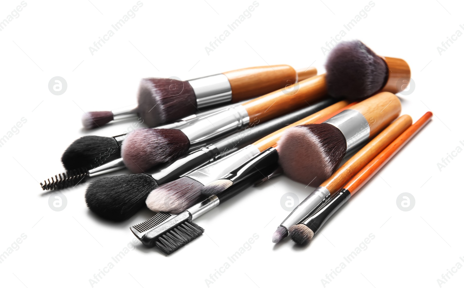 Photo of Makeup brushes of professional artist on white background