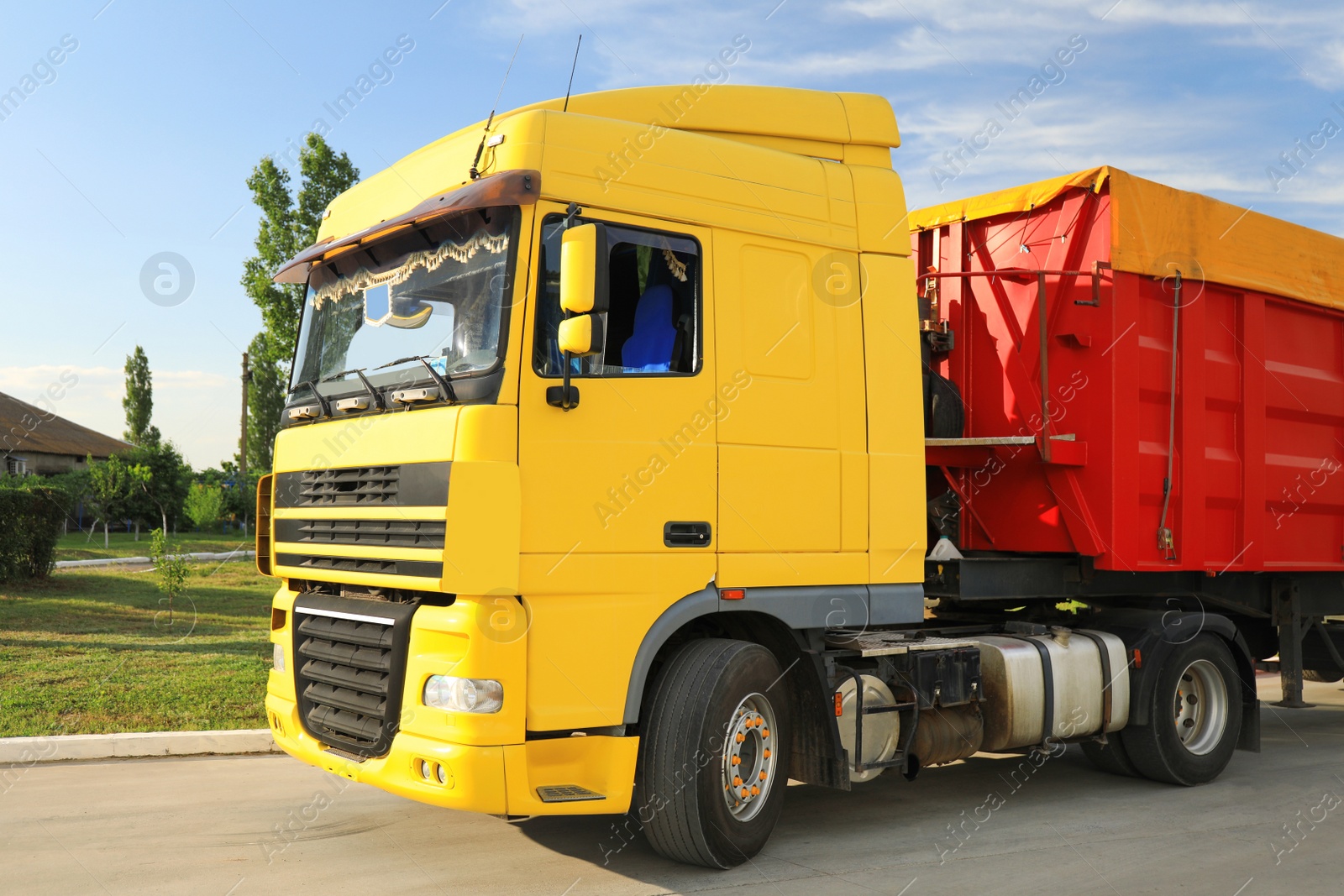 Photo of Modern bright truck parked on country road