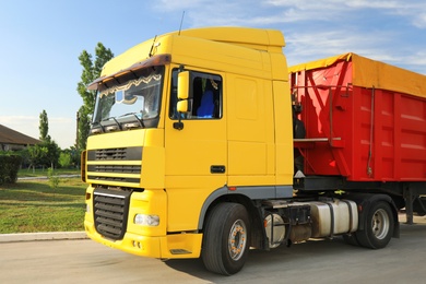 Modern bright truck parked on country road