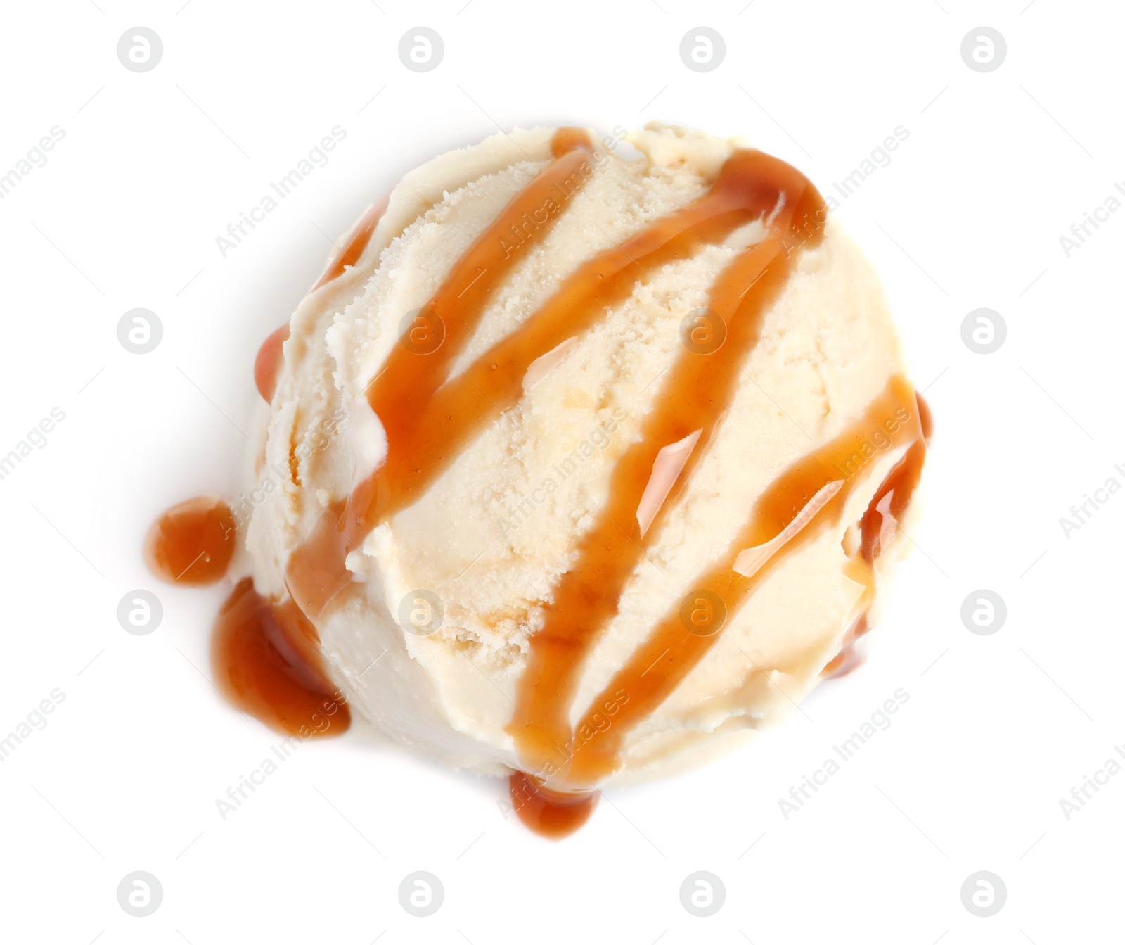 Photo of Tasty ice cream ball with caramel sauce on white background