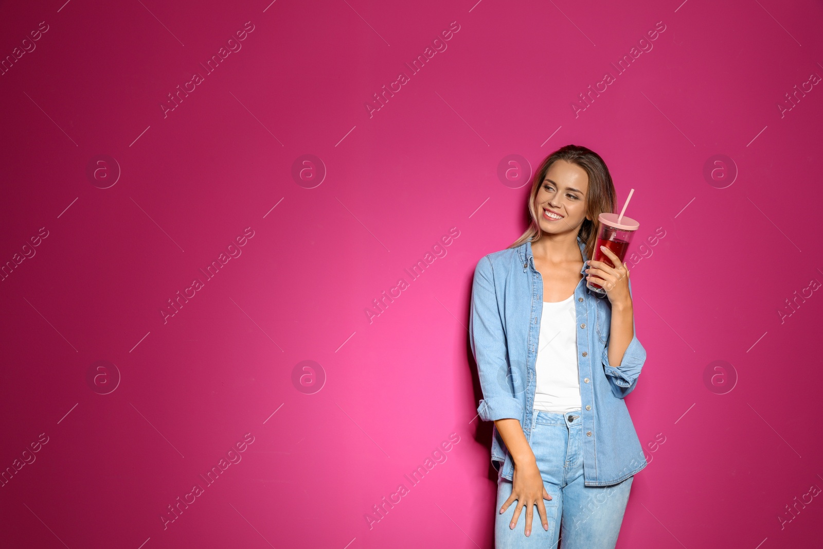 Photo of Portrait of beautiful woman with tasty drink on color background