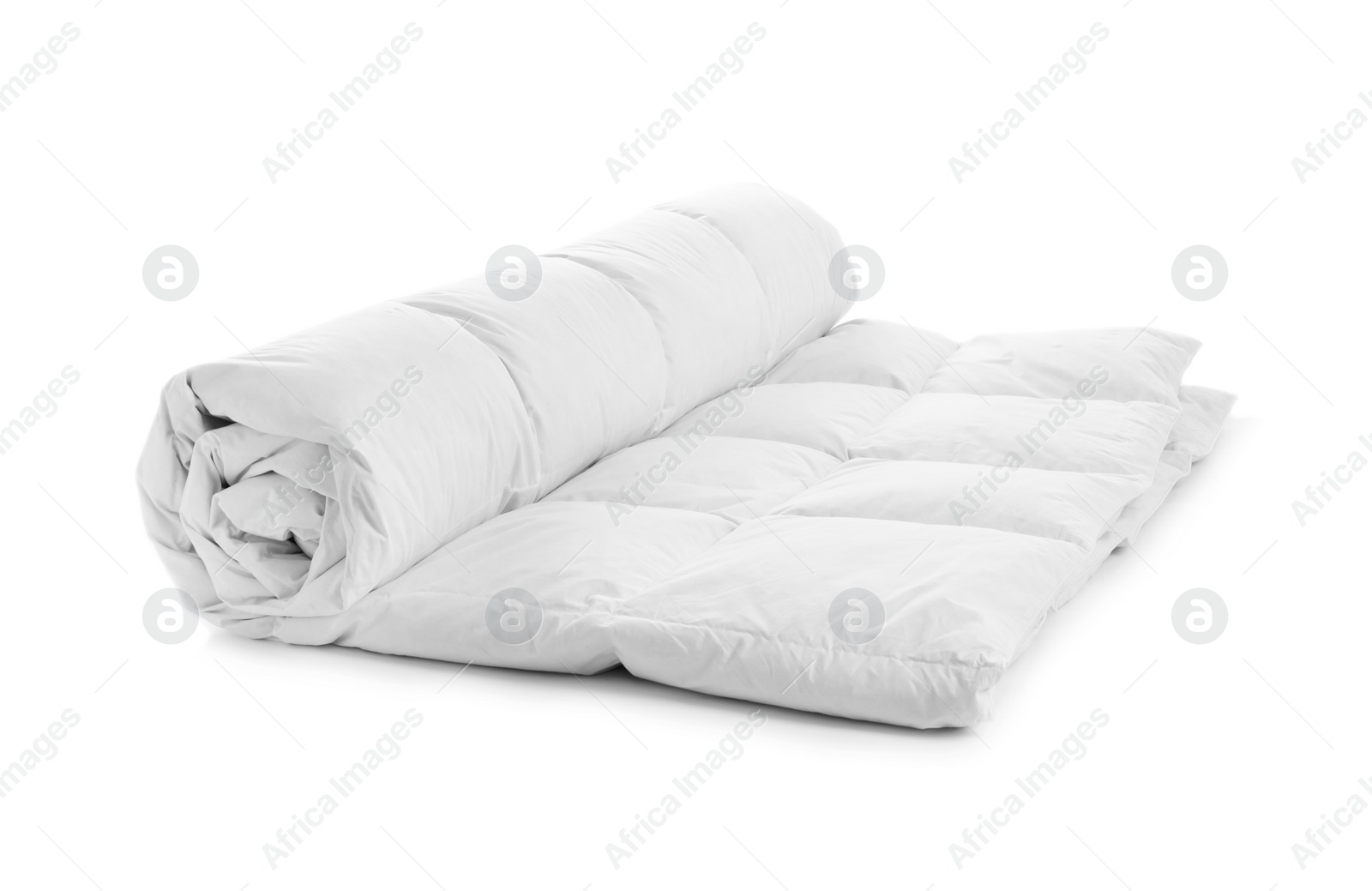 Photo of Rolled soft blanket on white background. Textile for bedroom interior