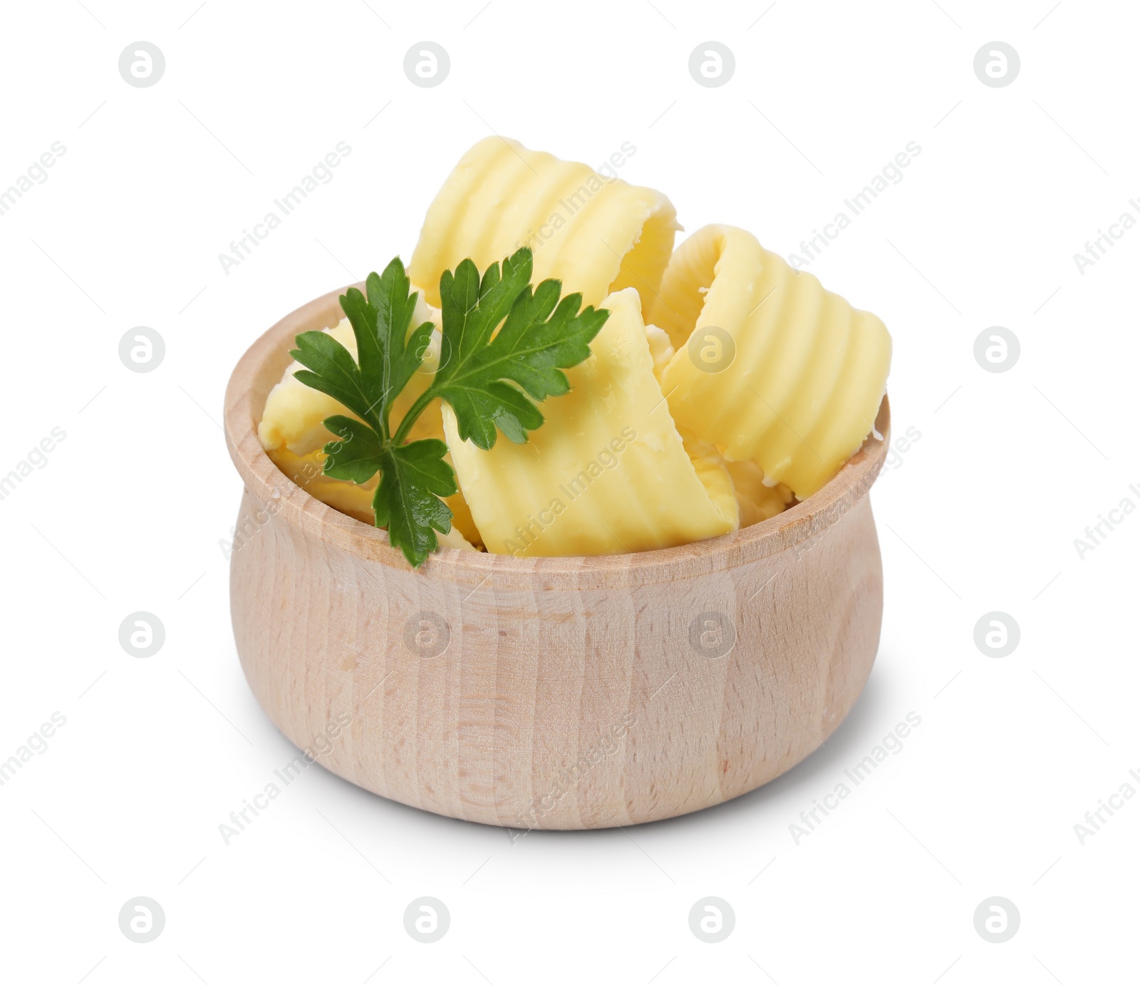 Photo of Tasty butter curls and fresh parsley in bowl isolated on white