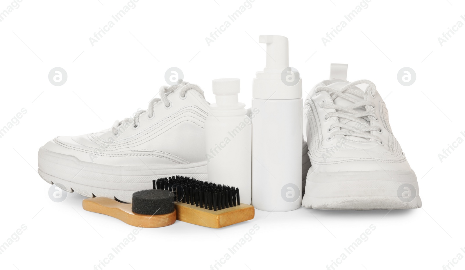 Photo of Composition with stylish footwear and shoe care accessories on white background