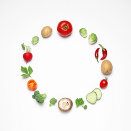 Frame of different fresh vegetables on white background, top view