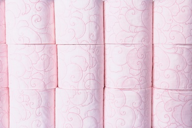 Photo of Many rolls of toilet paper as background. Personal hygiene