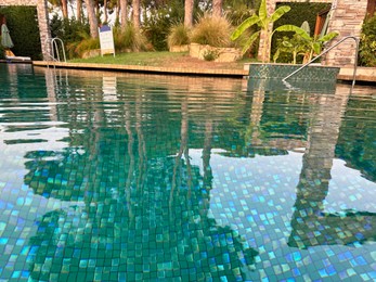 Swimming pool and exotic plants at luxury resort