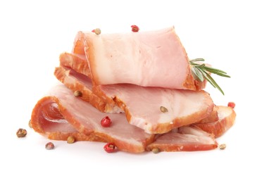 Photo of Slices of delicious smoked bacon with rosemary and peppercorns on white background