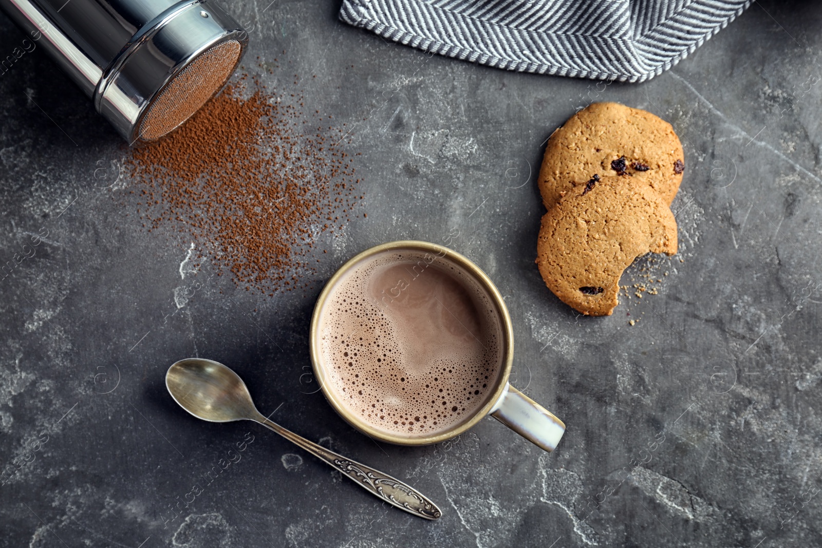 Photo of Flat lay composition with delicious hot cocoa drink on grey background