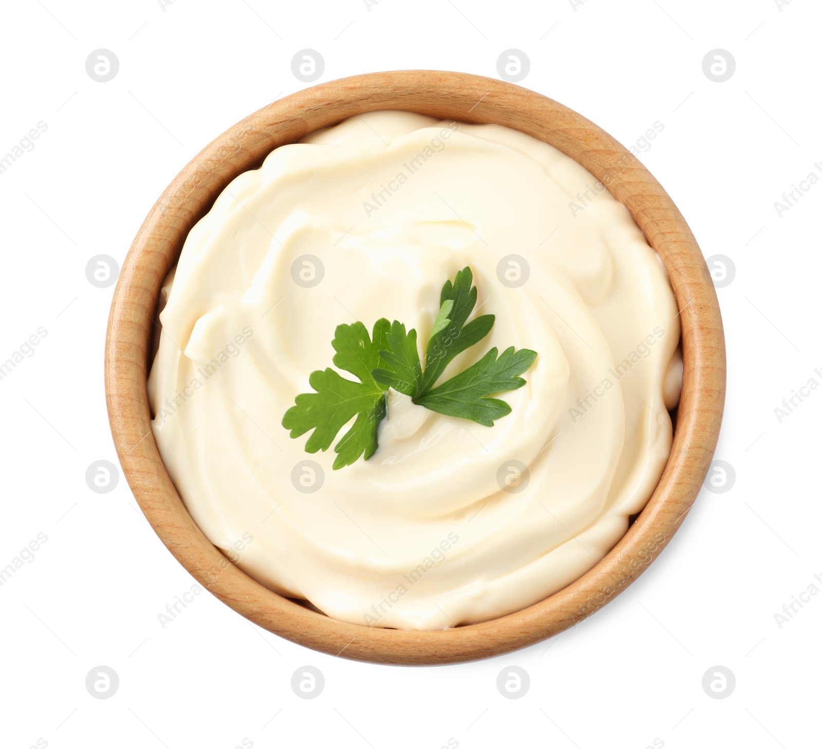 Photo of Bowl with delicious mayonnaise and parsley isolated on white, top view