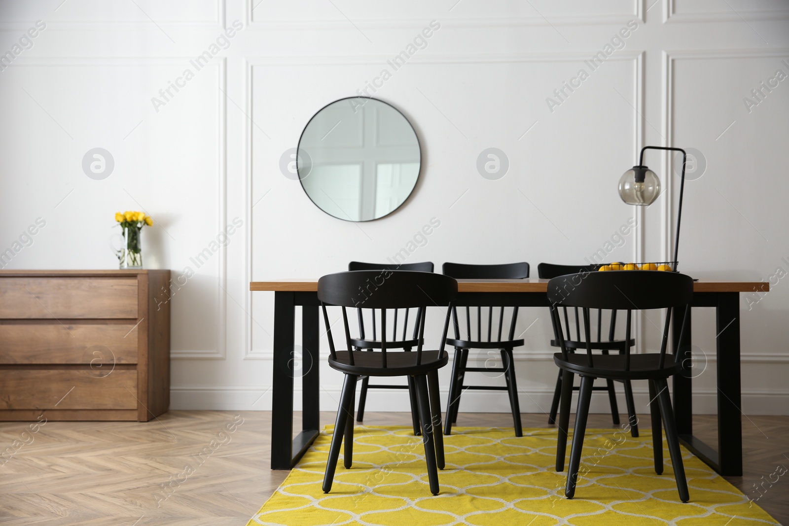 Photo of Stylish wooden dining table and chairs in room. Interior design