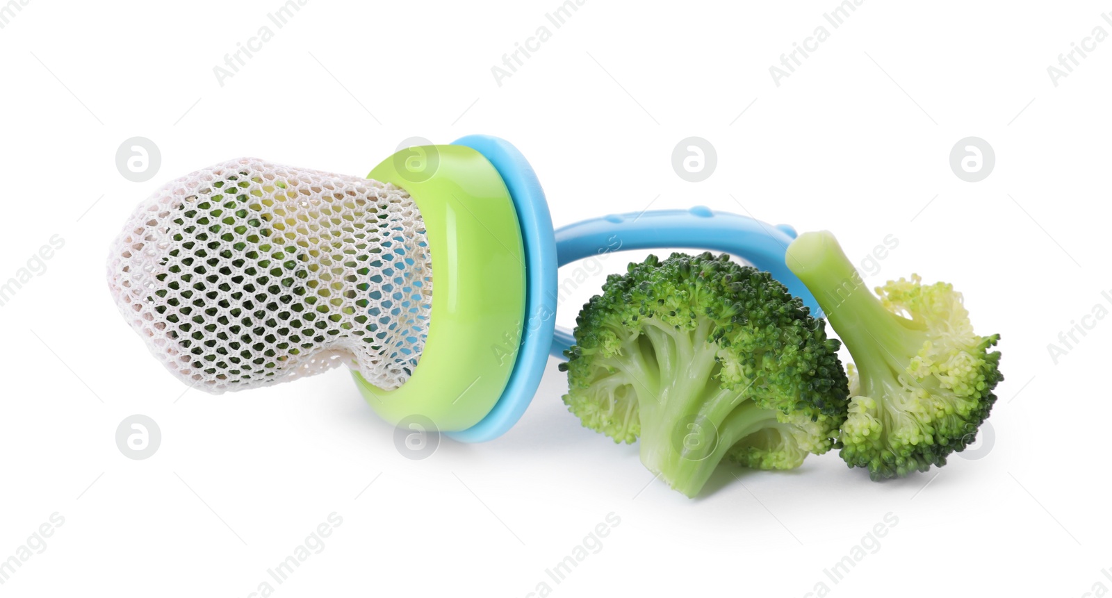 Photo of Nibbler with boiled broccoli on white background. Baby feeder