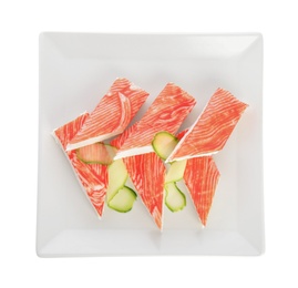 Fresh crab sticks with cucumber isolated on white, top view