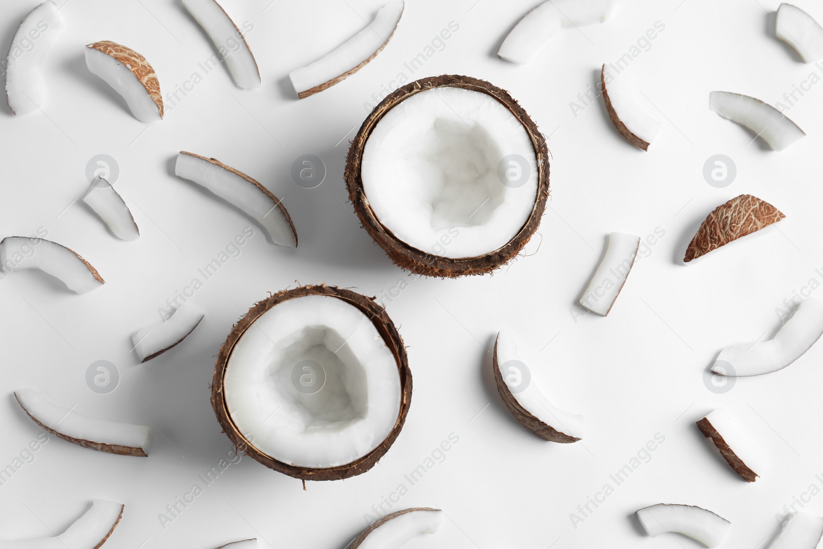 Photo of Ripe coconuts on white background, top view