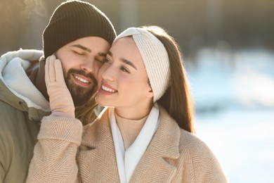 Photo of Beautiful young couple enjoying winter day outdoors