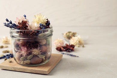 Photo of Aroma potpourri with different spices on white table, space for text