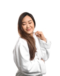 Portrait of beautiful Asian woman in bathrobe isolated on white. Spa treatment