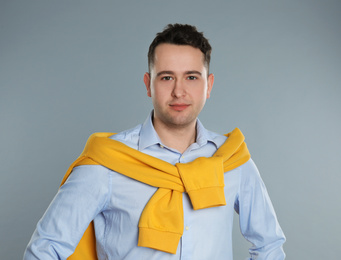 Photo of Portrait of young man on grey background